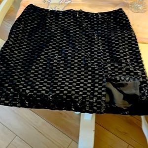 Black metallic lined mini skirt.
